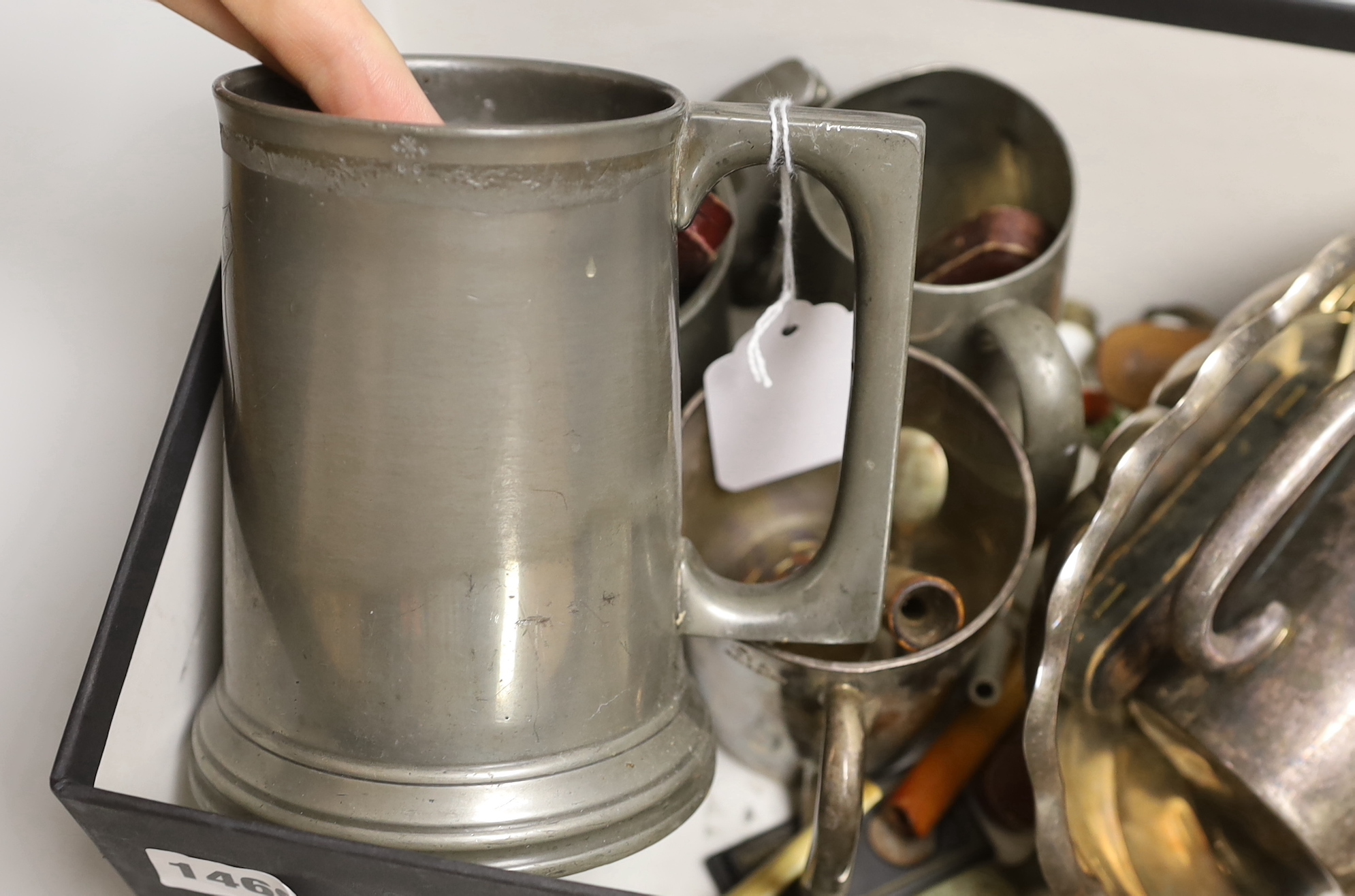 A group of assorted smoker's accoutrements and plated mugs